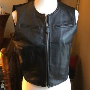 Short black leather vest.